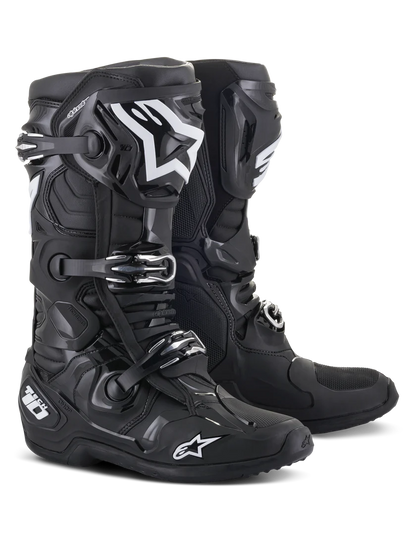 Black motorcycle boots with brand logo on a white background